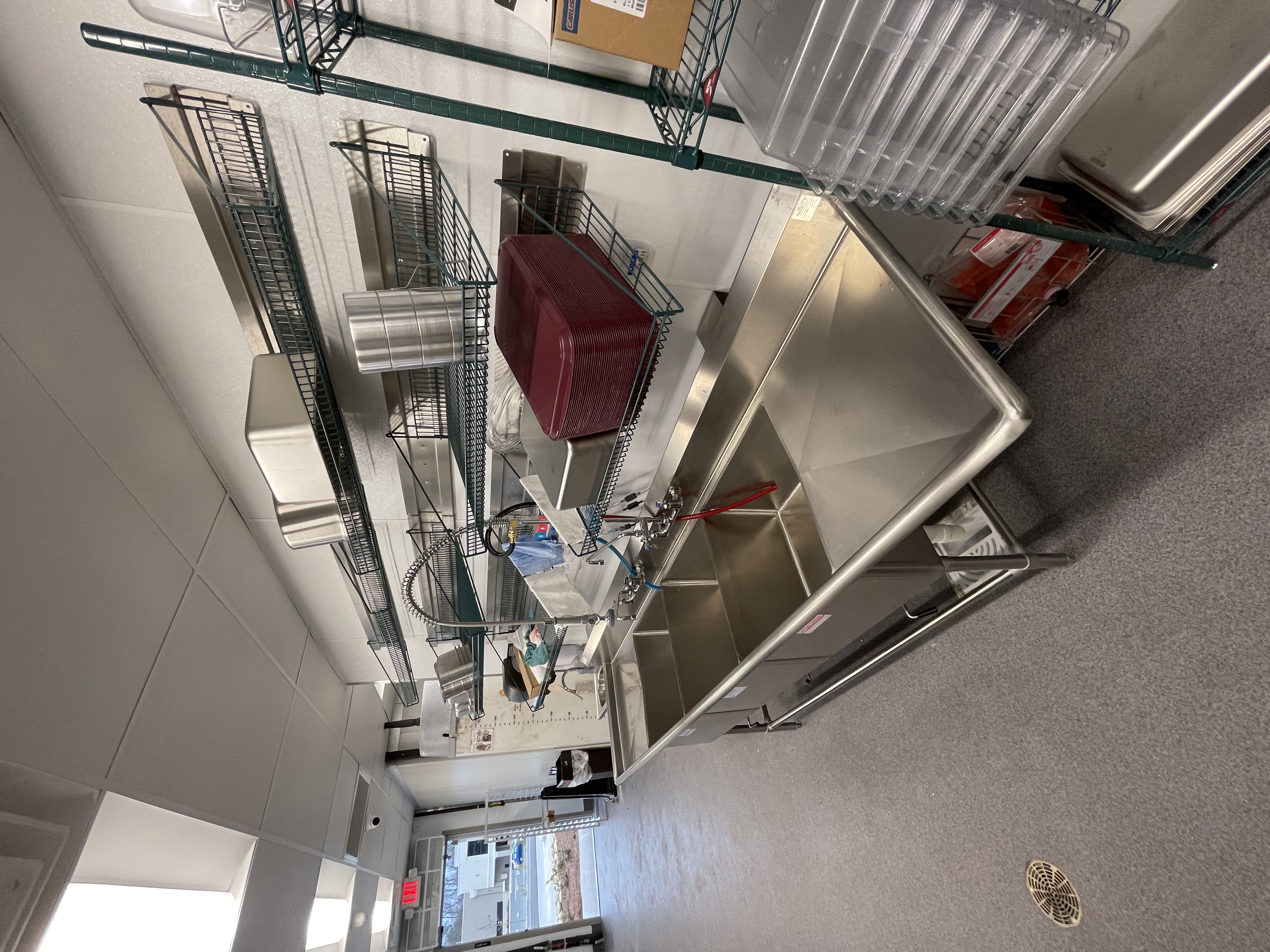 Back-of-house storage and smallwares staged for restaurant opening readiness