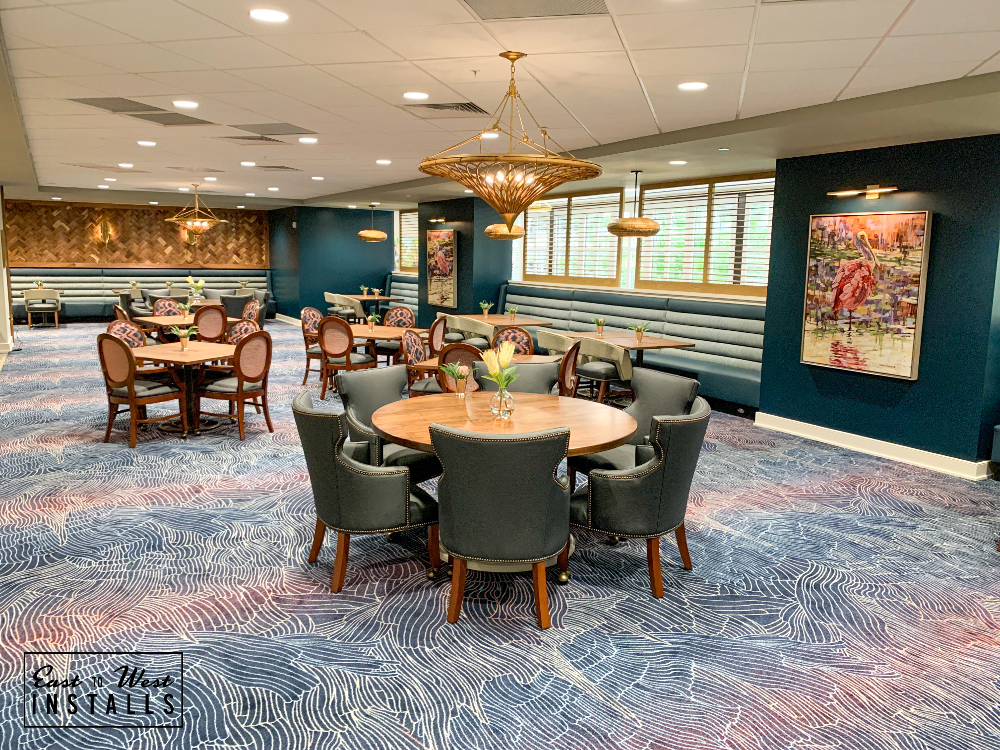 Village on the Isle — main dining room with gold chandelier