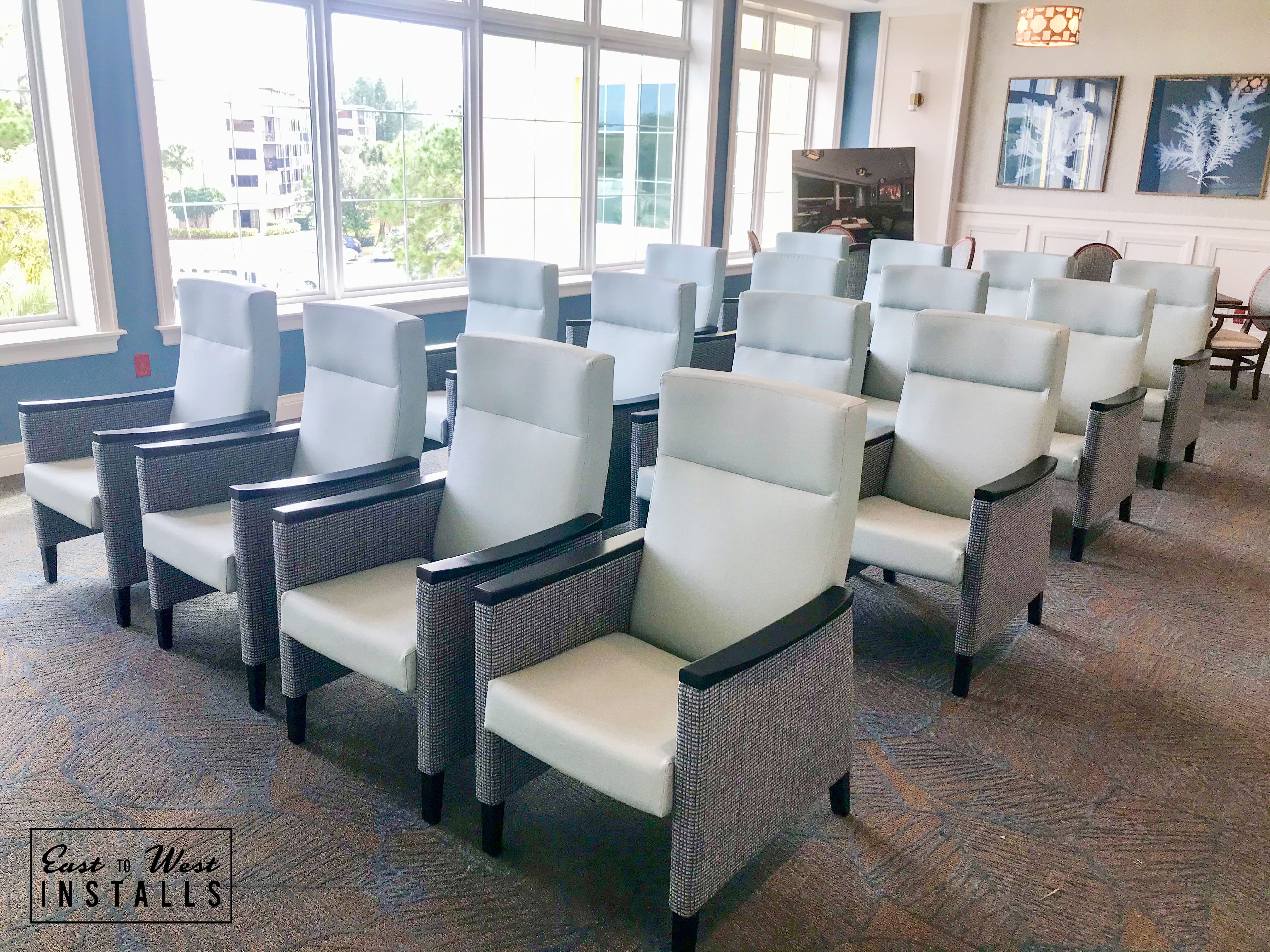 Social seating area — white chairs with natural light